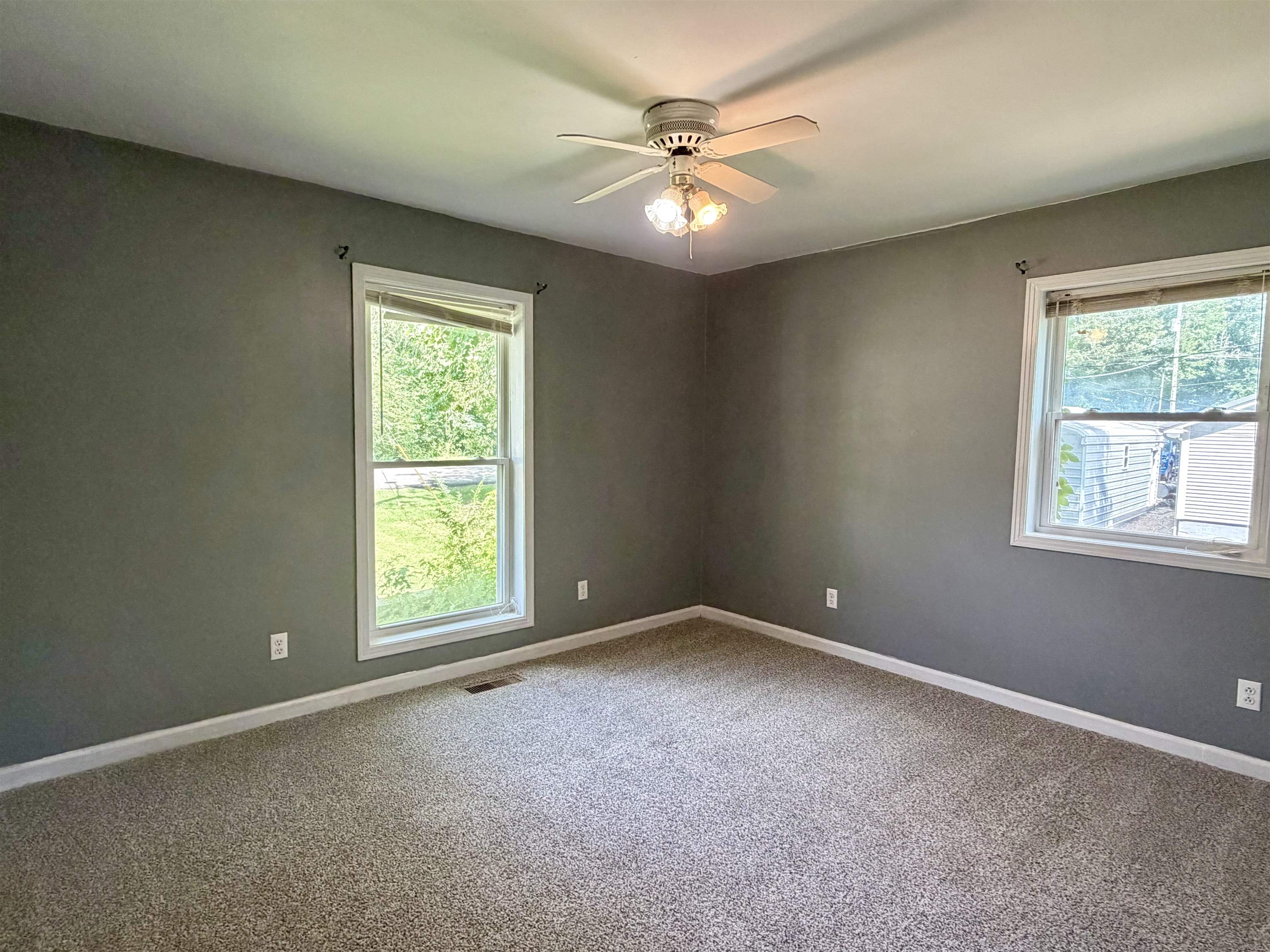 355 Purdy Road Selmer, TN 38375 - Photo 11 of 14 Spacious room featuring neutral carpeting and gray walls