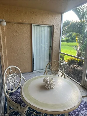 a backyard of a house with seating space