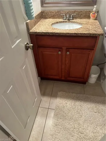 a white toilet sitting next to a bath tub