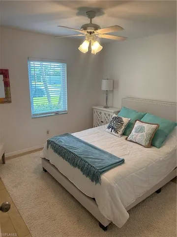 a bedroom with a bed and a television in it