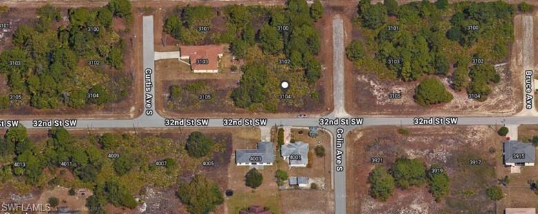 3104 Colin Avenue South Lehigh Acres, FL 33976 - Photo 2 of 2 swimming pool view with a garden