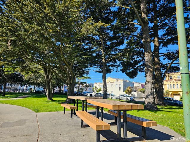 a view of a park with swings and slides