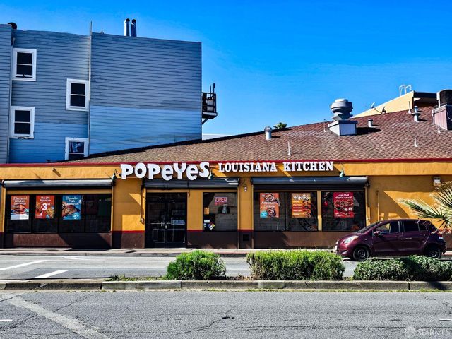 a front view of multiple houses with yard