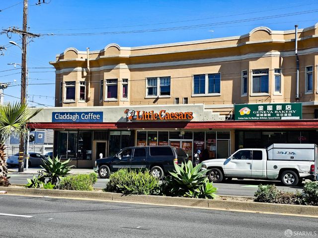 a front view of building with street