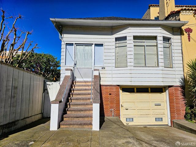 a front view of a house with a garage