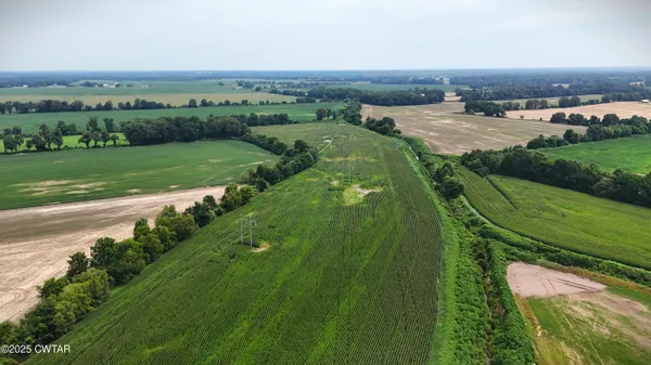 an aerial view of a golf course with parking space