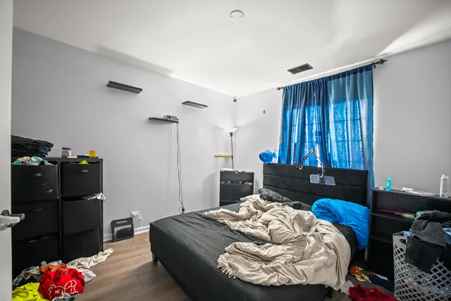 a bedroom with a bed and a closet