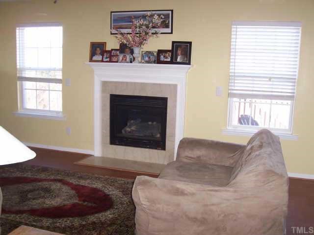 4704 Marathon Lane Raleigh, NC 27616 - Photo 4 of 9 a living room with furniture and a fireplace