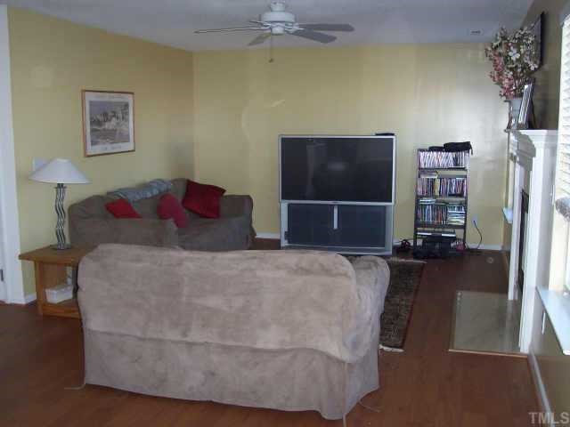4704 Marathon Lane Raleigh, NC 27616 - Photo 5 of 9 a living room with furniture and a flat screen tv