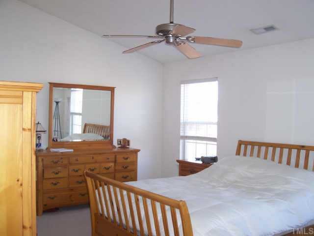 4704 Marathon Lane Raleigh, NC 27616 - Photo 6 of 9 a bedroom with furniture and window