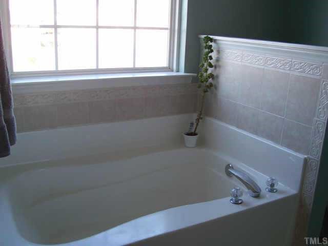 4704 Marathon Lane Raleigh, NC 27616 - Photo 8 of 9 a bathroom with a bathtub