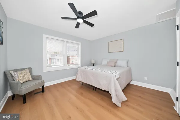 a bedroom with a bed and a couch