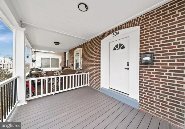 a view of a balcony with wooden floor