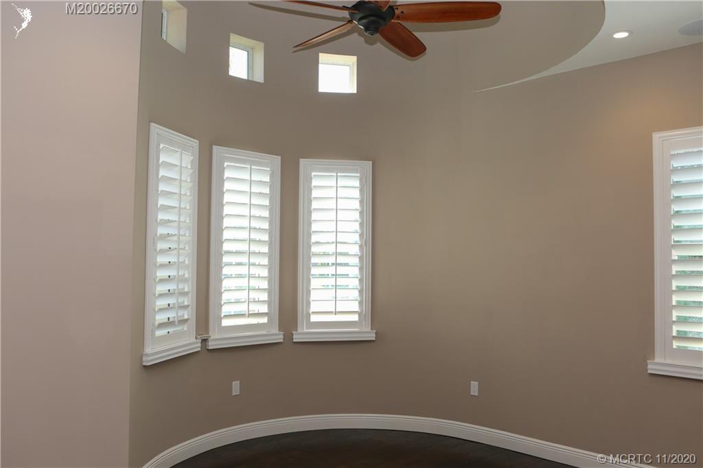 4961 Southeast Inlet Isle Way Stuart, FL 34997 - Photo 11 of 37 an empty room with a window