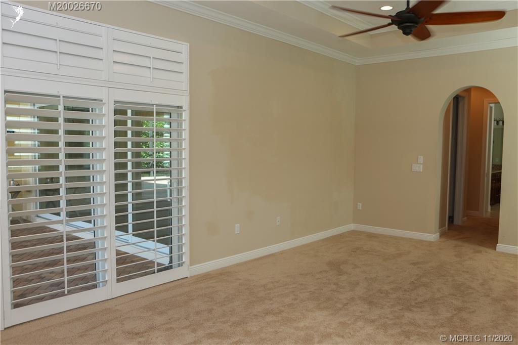 4961 Southeast Inlet Isle Way Stuart, FL 34997 - Photo 18 of 37 a view of an empty room with a window