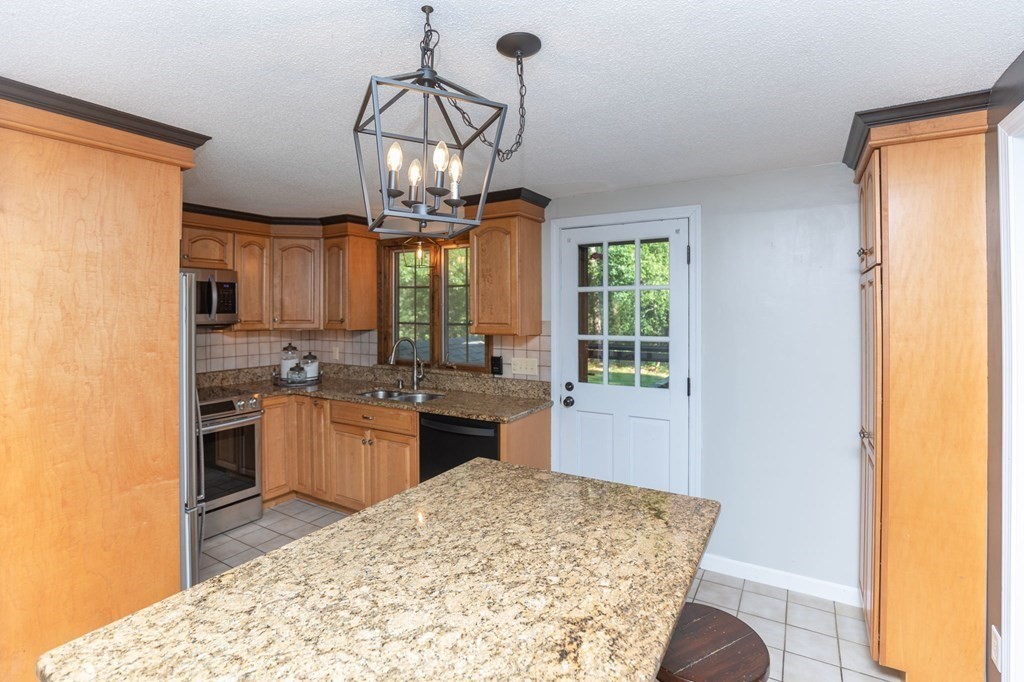 236 High Street Rochester, MA 02770 - Photo 8 of 35 a kitchen with stainless steel appliances granite countertop a sink stove and refrigerator