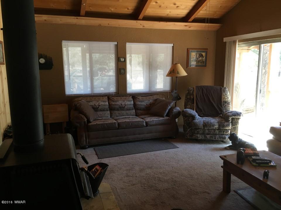 2846 Timber Trail Loop Overgaard, AZ 85933 - Photo 5 of 16 a living room with furniture and a window