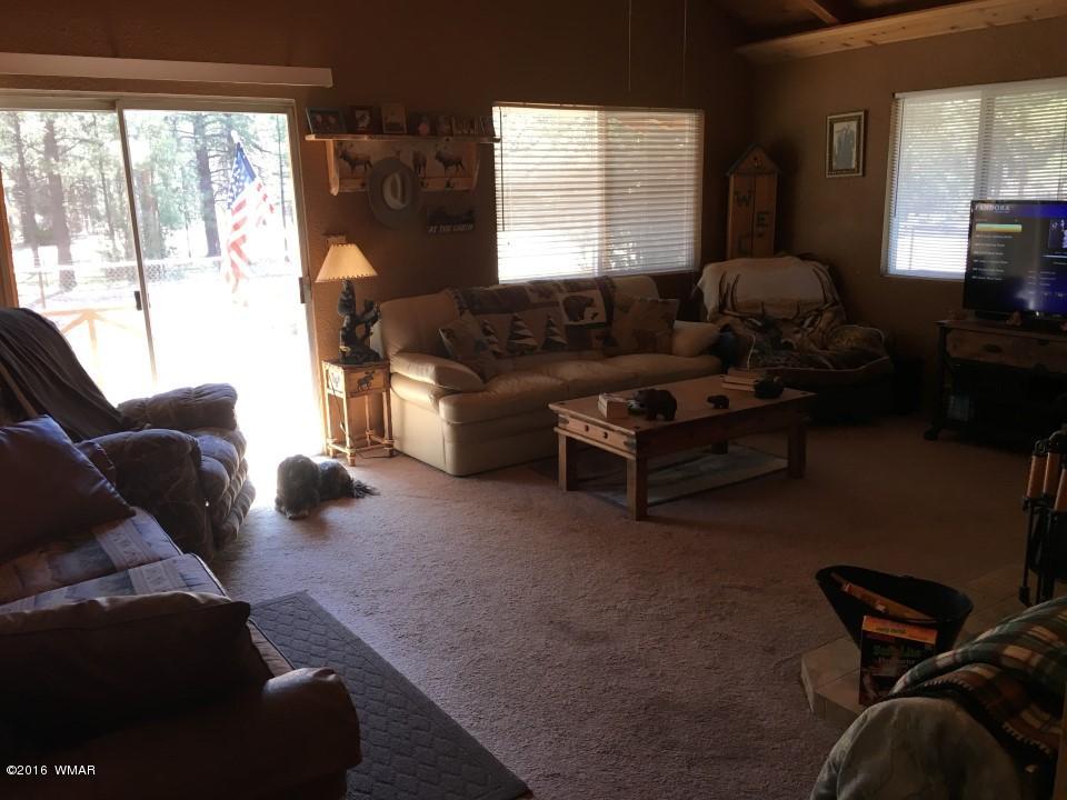 2846 Timber Trail Loop Overgaard, AZ 85933 - Photo 6 of 16 a living room with furniture and a large window