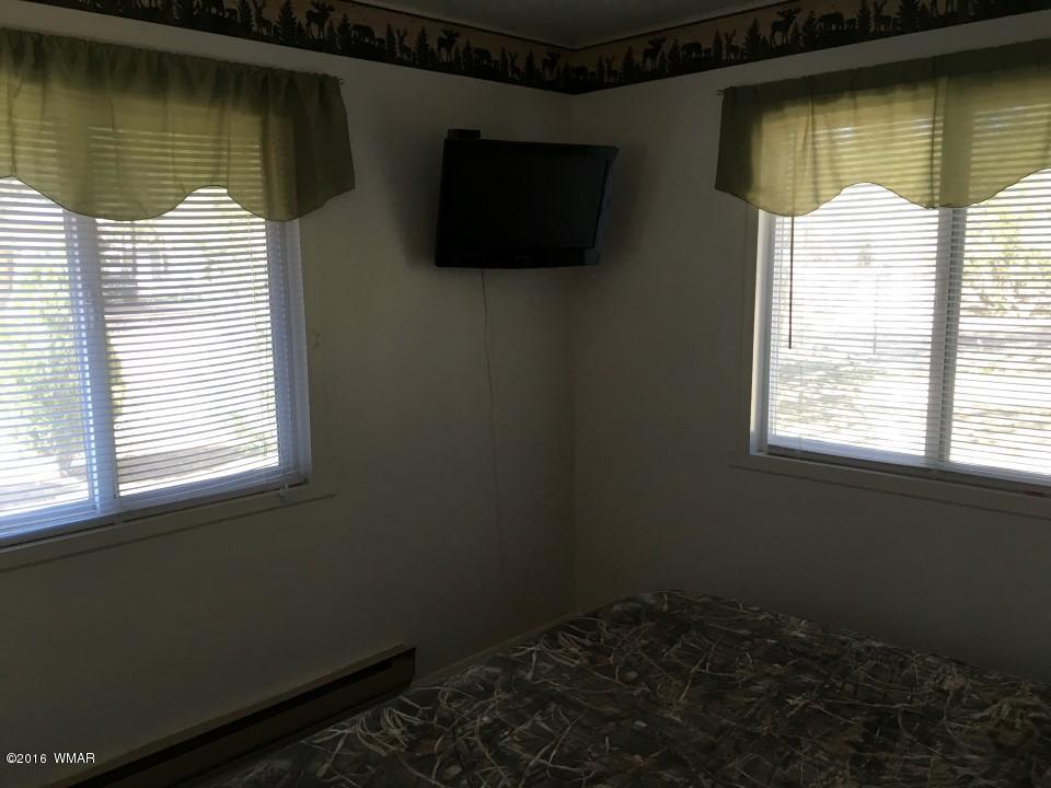 2846 Timber Trail Loop Overgaard, AZ 85933 - Photo 10 of 16 a room with a window