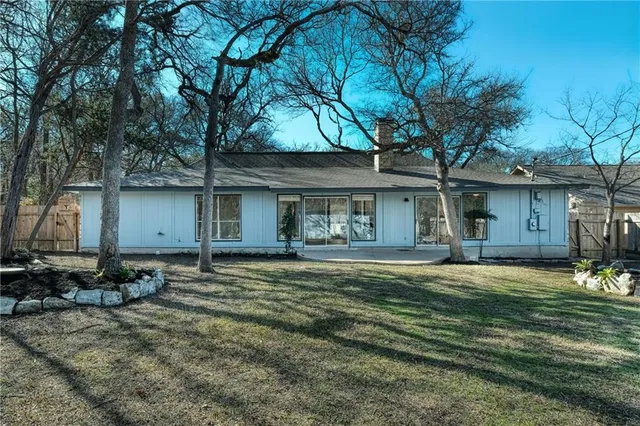 a view of a yard with a tree