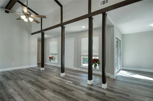 a view of an entryway with wooden floor