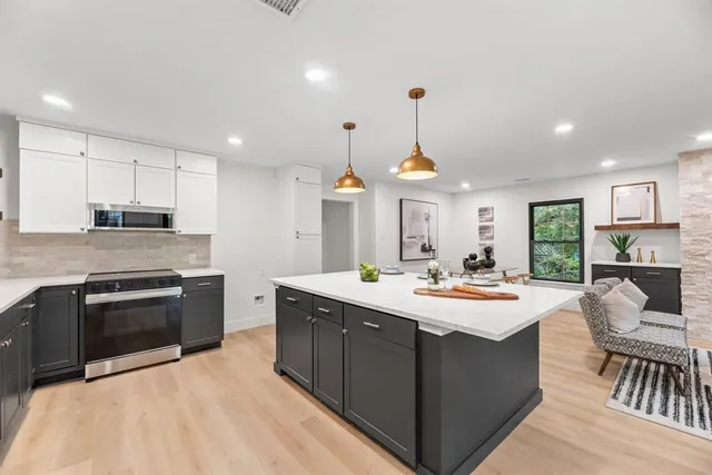 a bathroom with a sink a mirror and a bathtub