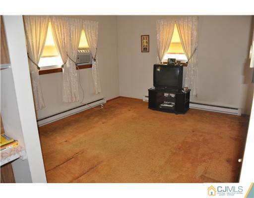 35 Cedar Street Edison, NJ 08820 - Photo 8 of 10 a view of a livingroom with wooden floor