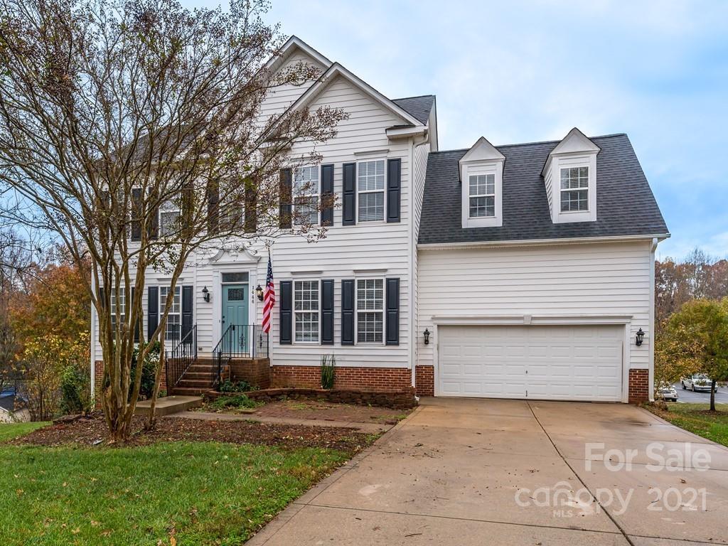 1446 Autumn Ridge Lane Fort Mill, SC 29708 - Photo 1 of 35 a front view of a house with a yard and garage