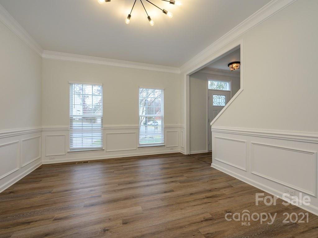 1446 Autumn Ridge Lane Fort Mill, SC 29708 - Photo 7 of 35 wooden floor in an empty room with a window