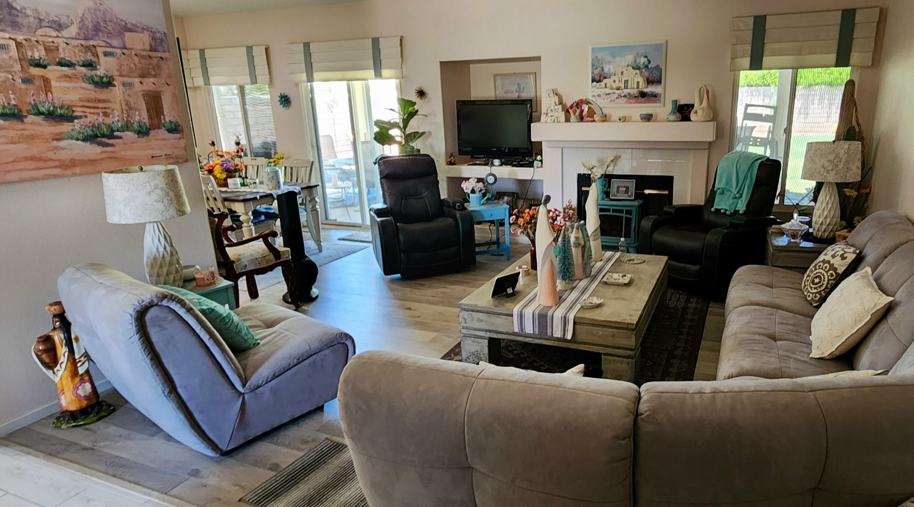 78820 Irwin Circle La Quinta, CA 92253 - Photo 5 of 12 a living room with furniture fireplace and flat screen tv