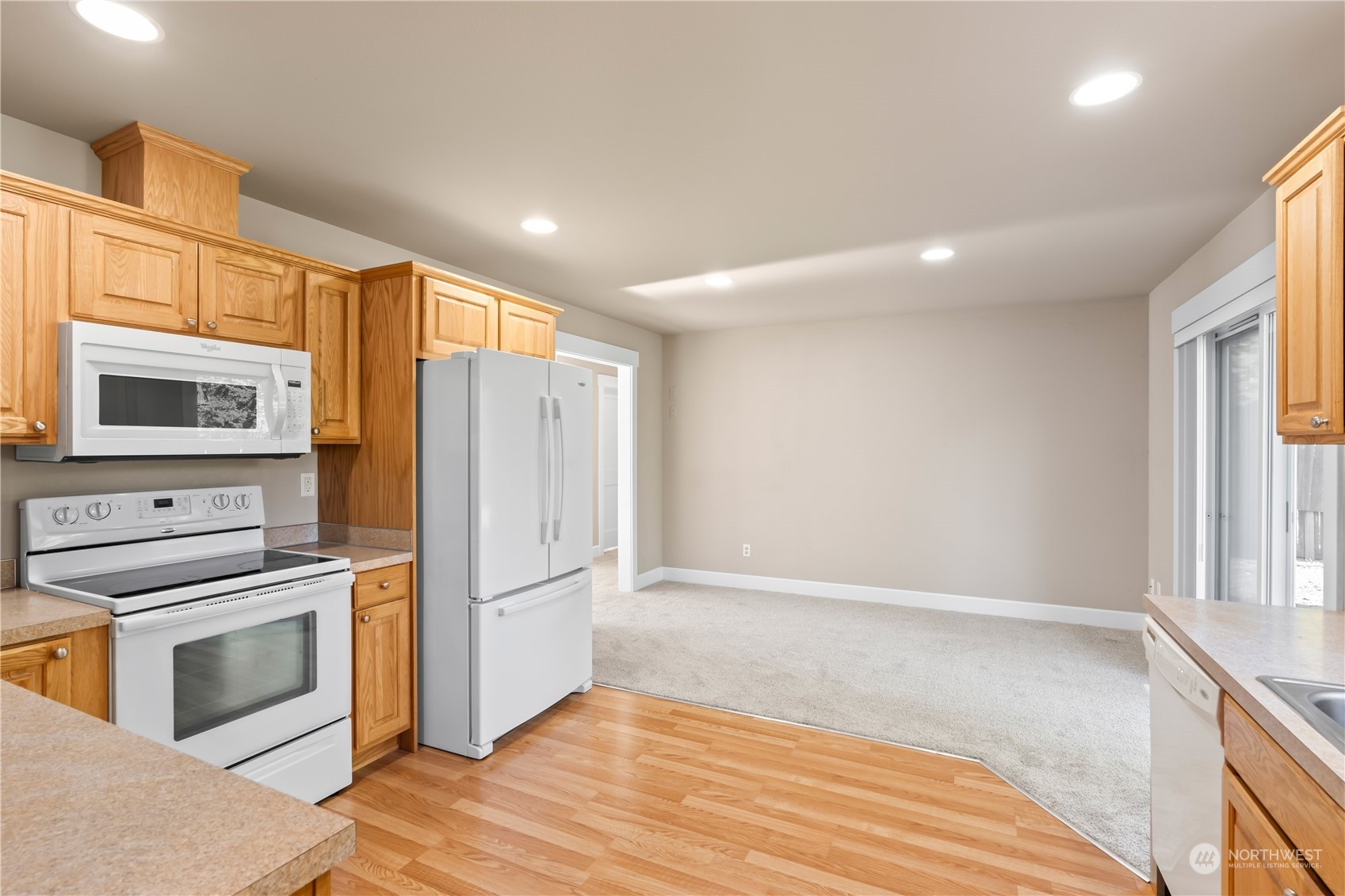 1189 Spiketon Road Buckley, WA 98321 - Photo 11 of 31 a kitchen with granite countertop a refrigerator stove and oven