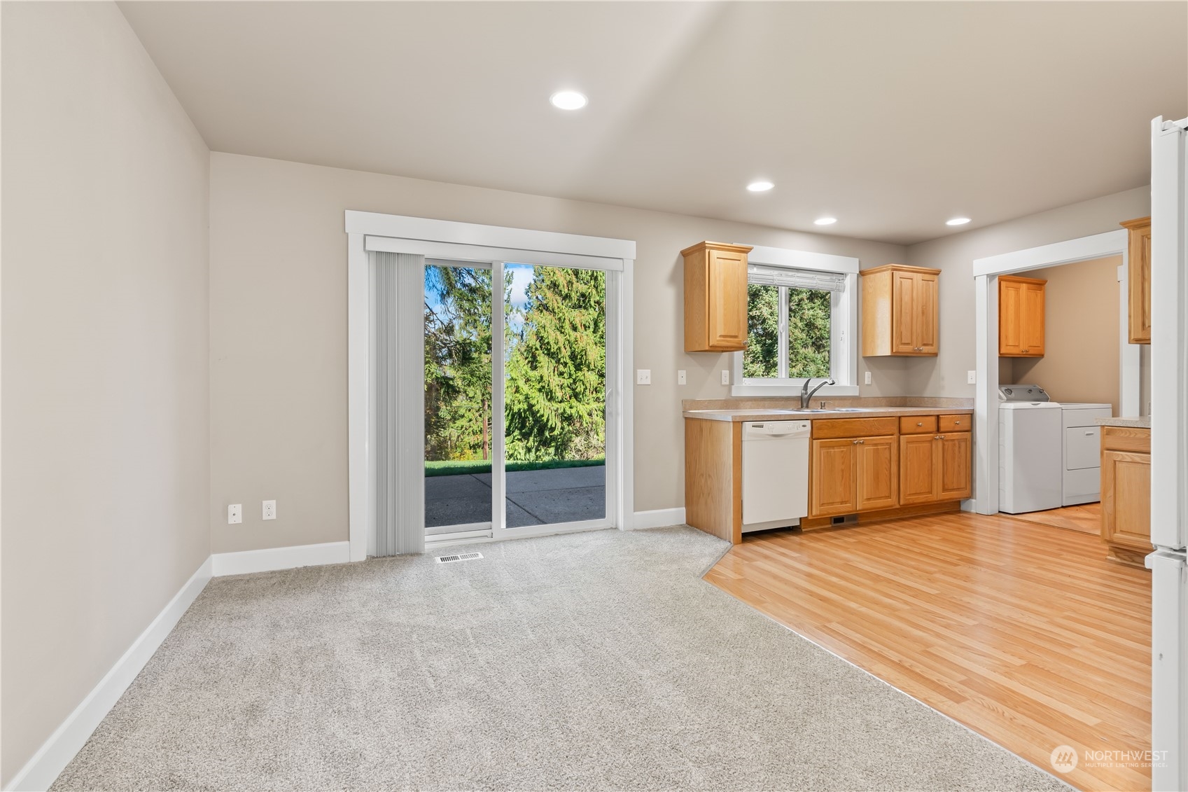 1189 Spiketon Road Buckley, WA 98321 - Photo 12 of 31 a view of a kitchen with wooden floor and electronic appliances