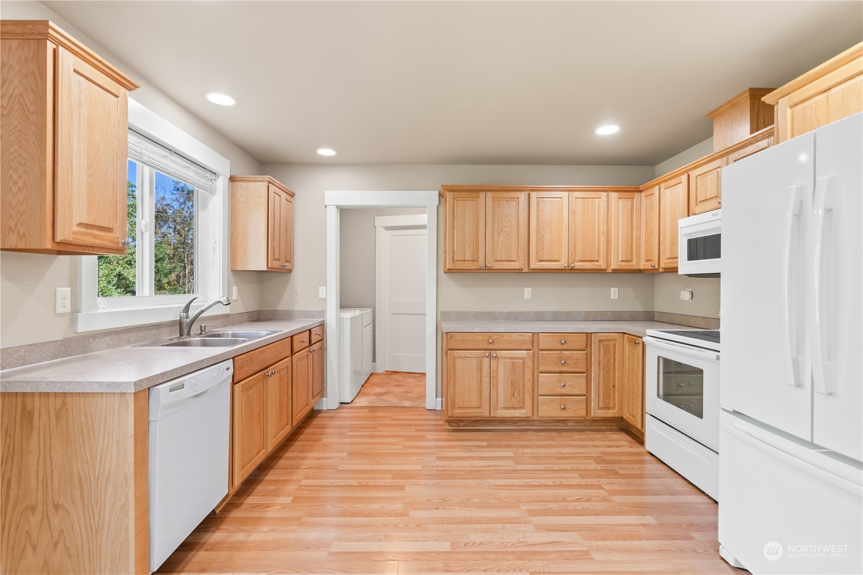 1189 Spiketon Road Buckley, WA 98321 - Photo 13 of 31 a kitchen with stainless steel appliances granite countertop a sink and cabinets