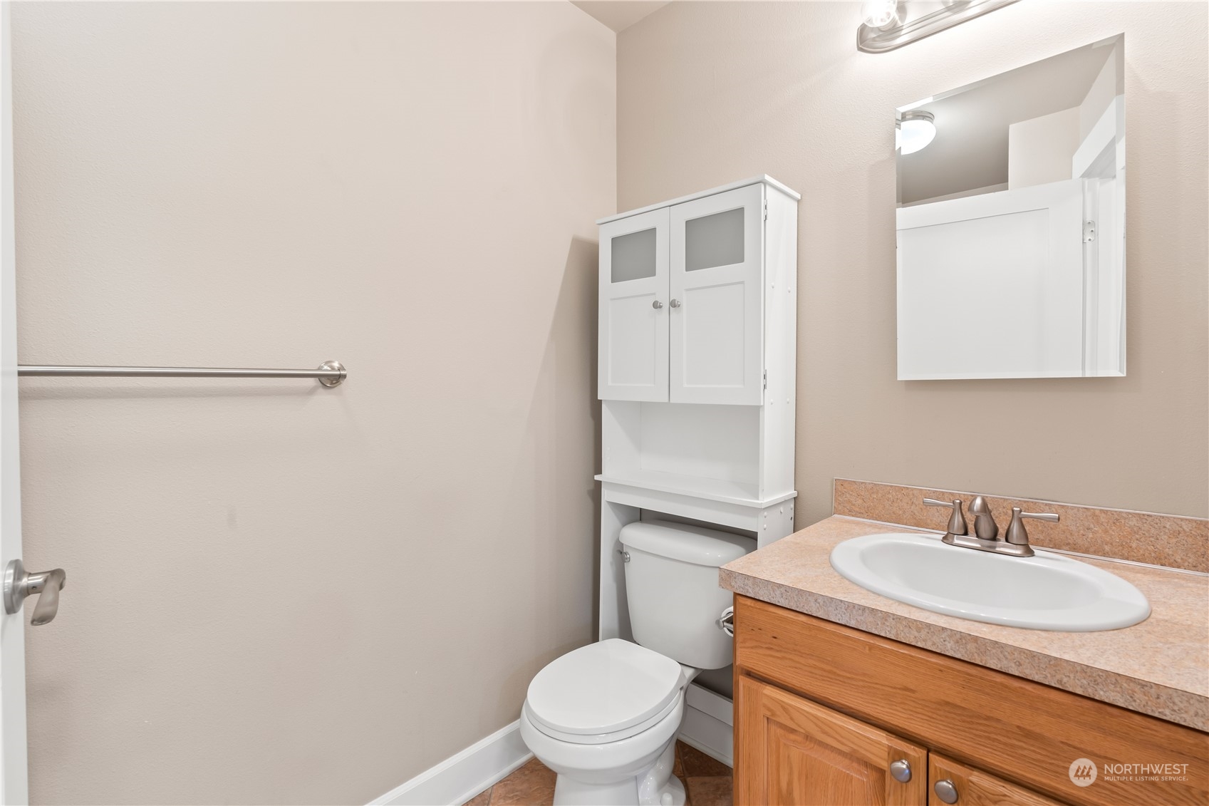 1189 Spiketon Road Buckley, WA 98321 - Photo 16 of 31 a bathroom with a sink toilet and a mirror