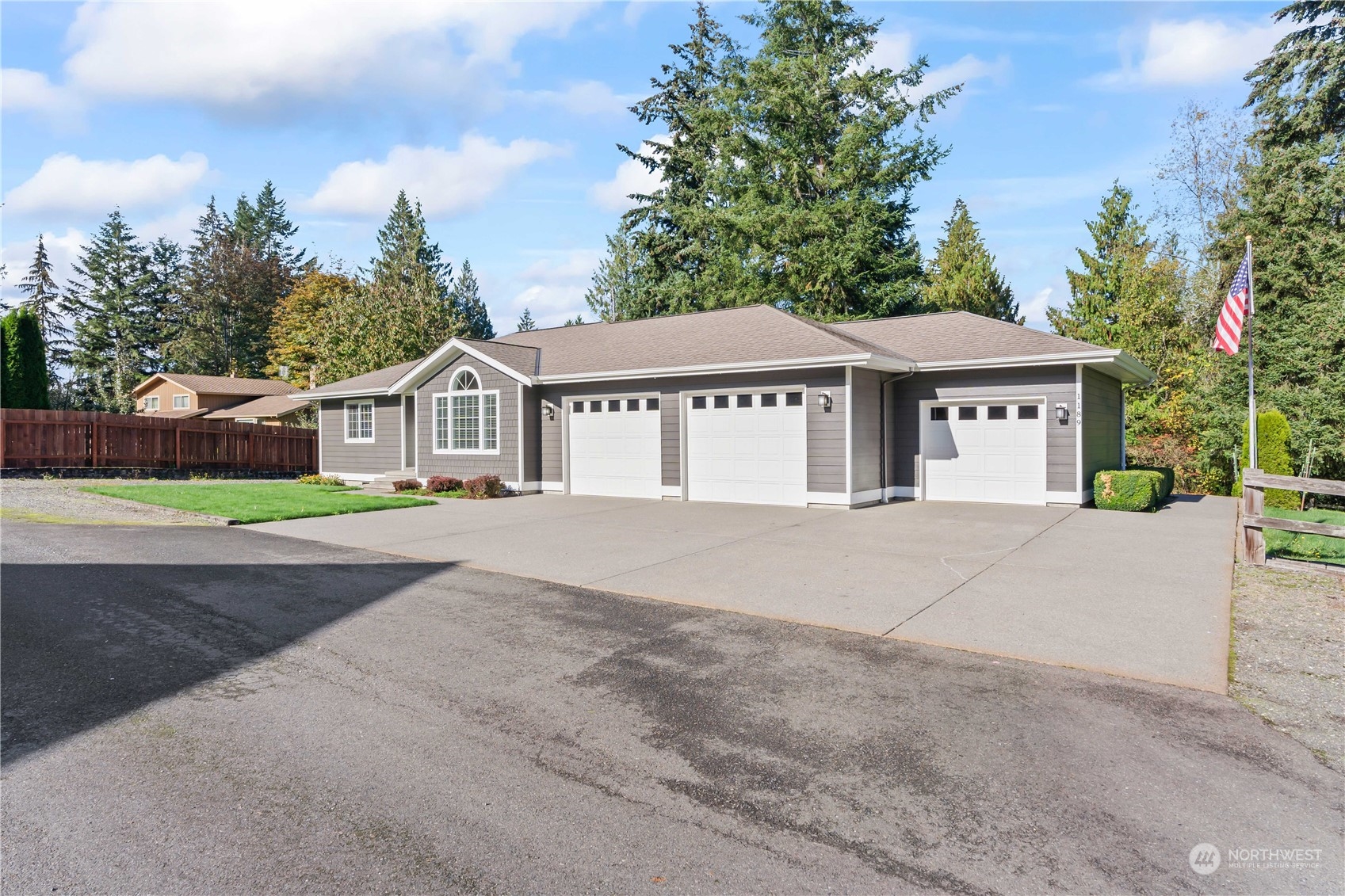 1189 Spiketon Road Buckley, WA 98321 - Photo 7 of 31 a front view of a house with a yard and garage