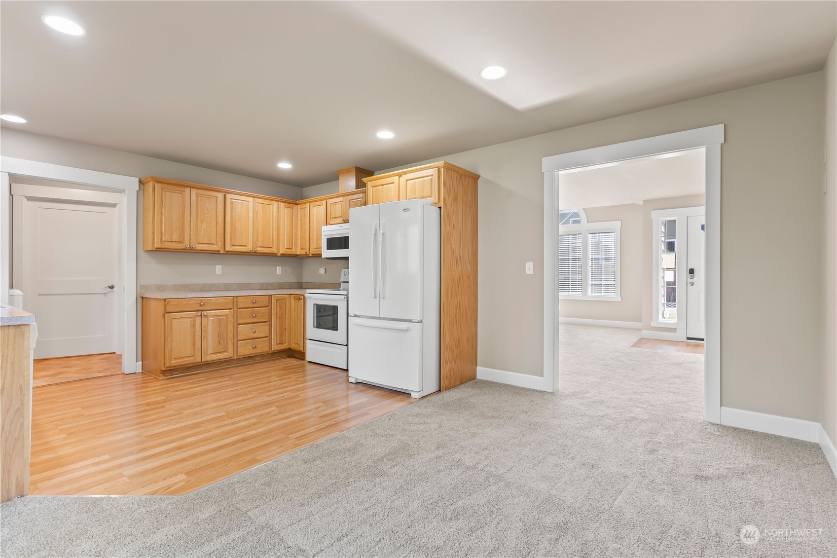 1189 Spiketon Road Buckley, WA 98321 - Photo 10 of 31 a view of kitchen with refrigerator cabinets and wooden floor