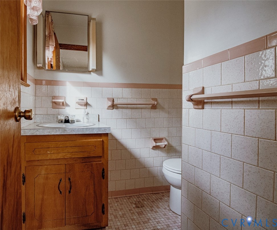 6710 Heritage Road Prince George, VA 23875 - Photo 24 of 27 a bathroom with a sink a toilet and mirror