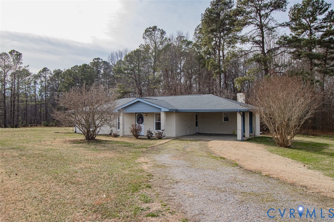 6710 Heritage Road Prince George, VA 23875 - Photo 3 of 27 a house with trees in front of it