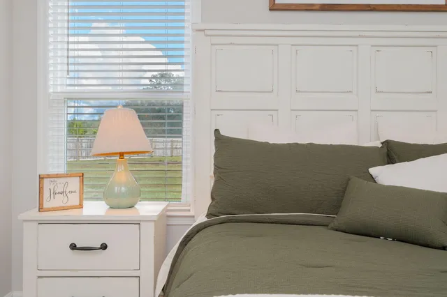 a bathroom with a sink a toilet and a large mirror