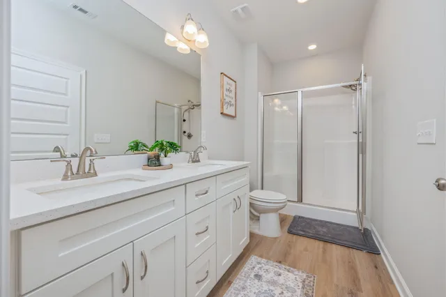 a bathroom with a glass shower door
