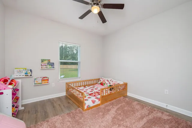 an empty room with painting on the wall