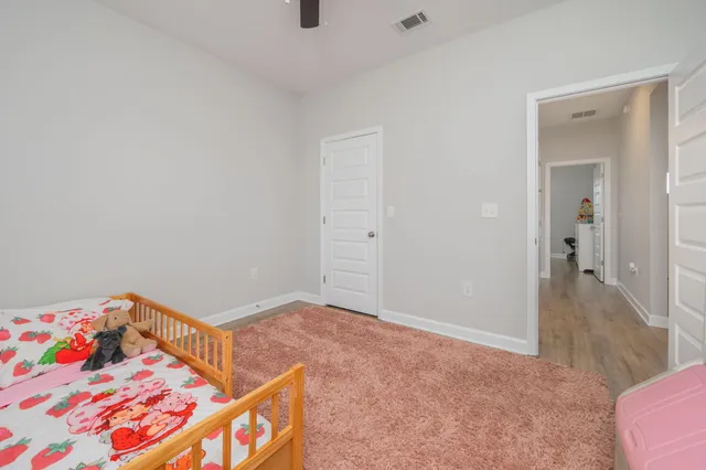 a bedroom with furniture and a window