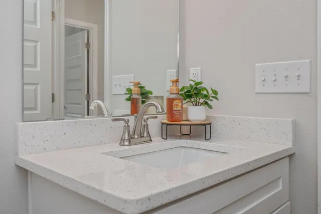 a white toilet sitting next to a shower