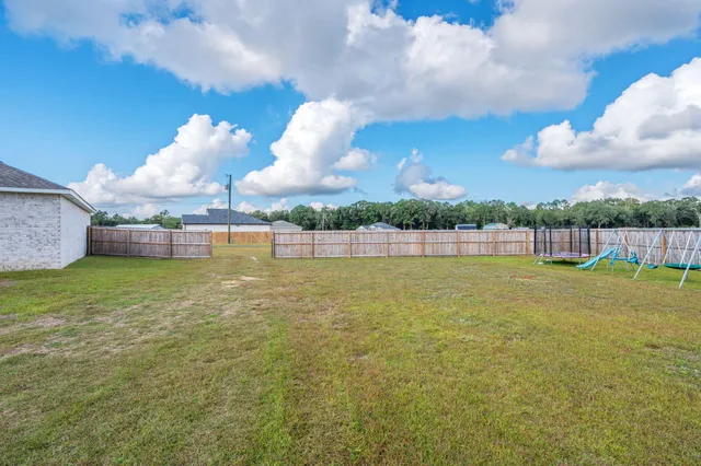a view of yard with green space and porch
