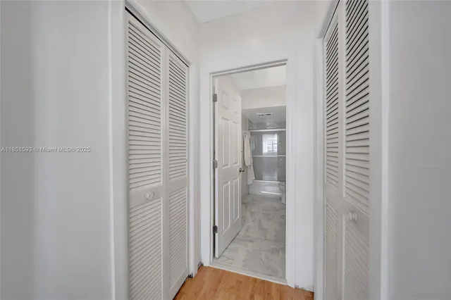 a view of a bathroom from a hallway