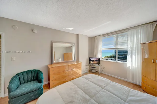 a bedroom with furniture and a window