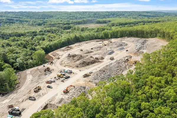 a view of a valley with a mountain in the background