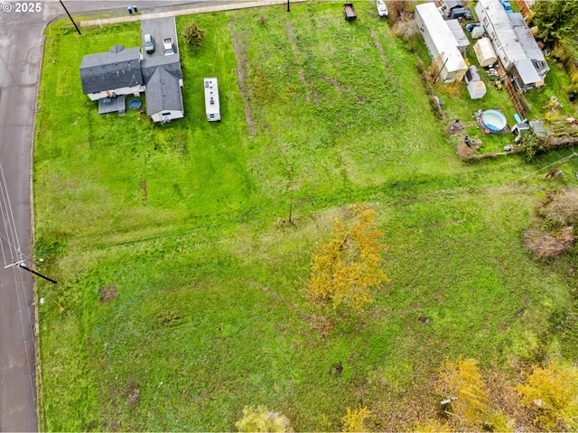 a backyard of a house with lots of green space