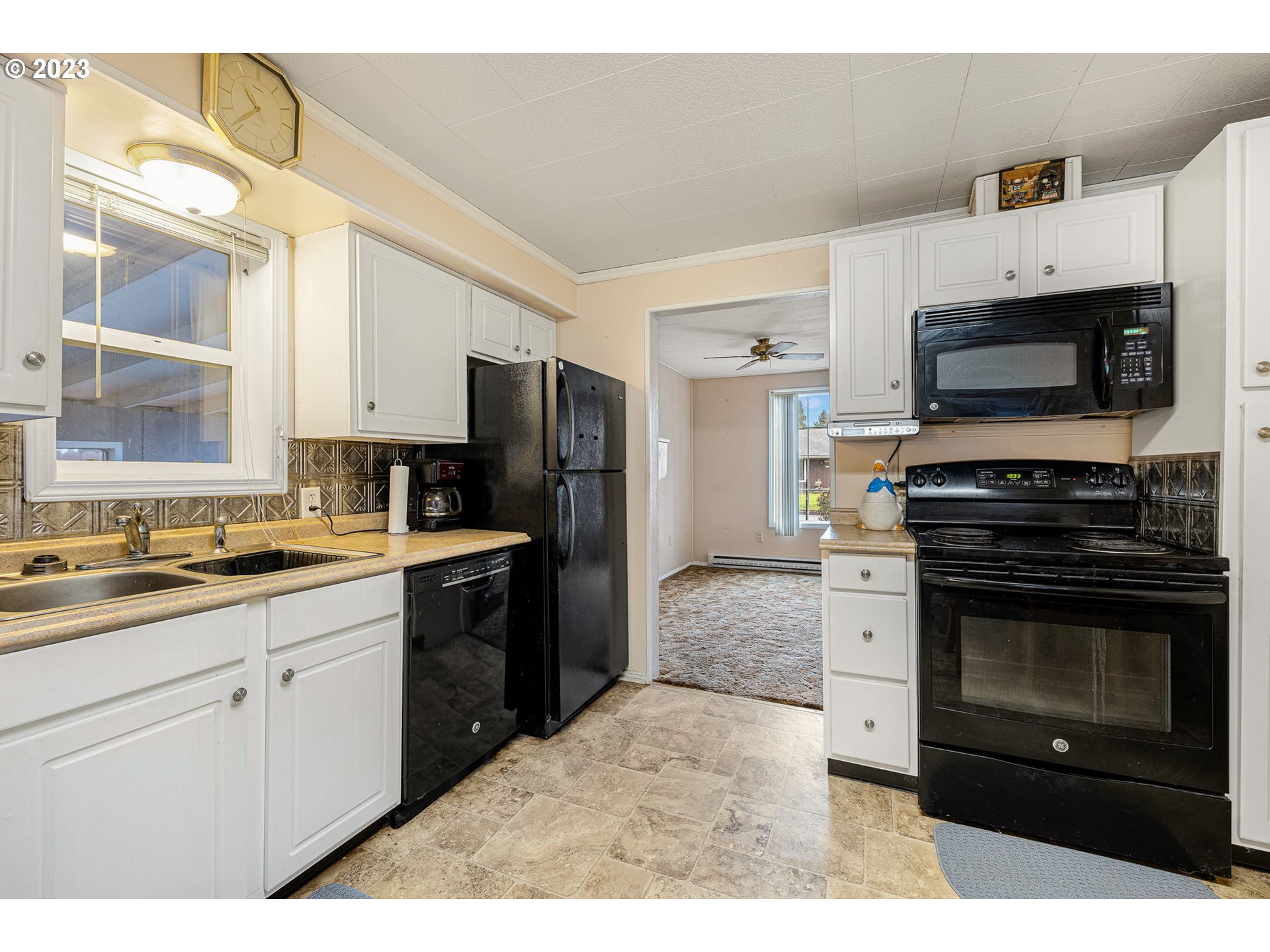 2500 J Street Springfield, OR 97477 - Photo 11 of 27 a kitchen with stainless steel appliances a stove microwave and refrigerator