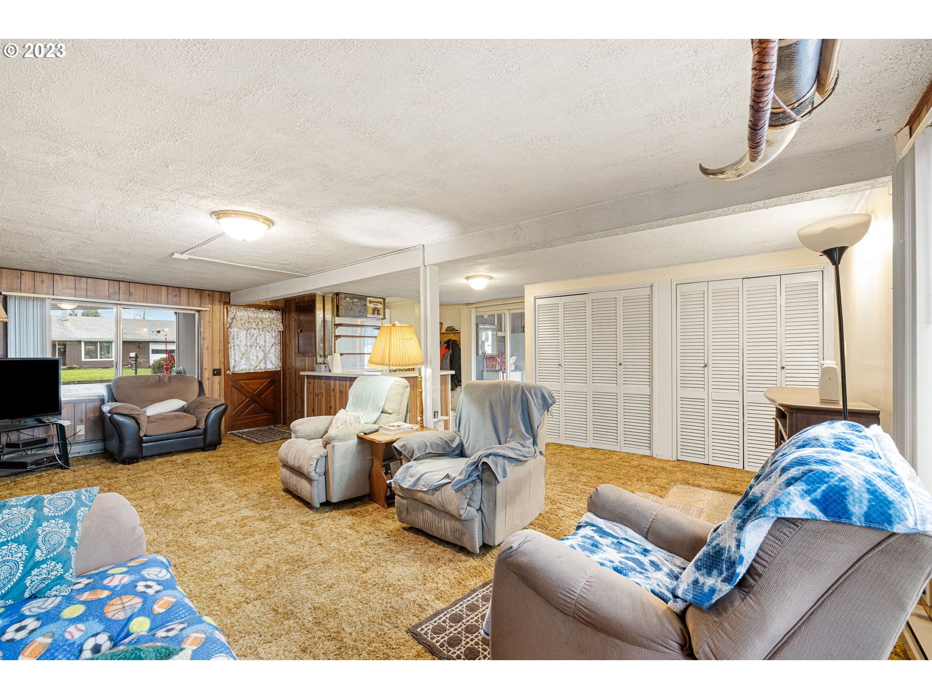 2500 J Street Springfield, OR 97477 - Photo 14 of 27 a living room with furniture ceiling fan and a rug